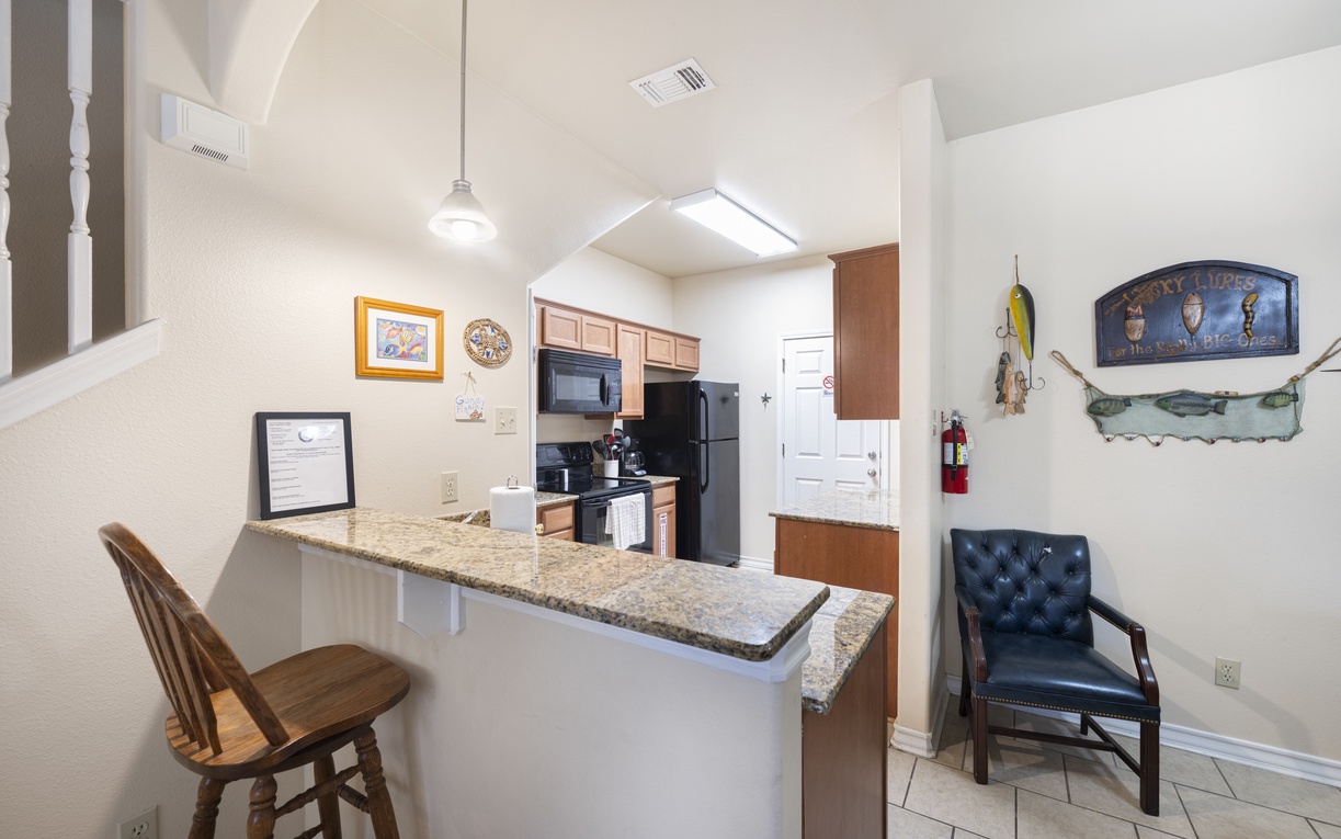 Settle into your fully equipped kitchen with granite countertops, modern appliances, and a welcoming breakfast bar—your perfect spot for morning coffee or casual meals.