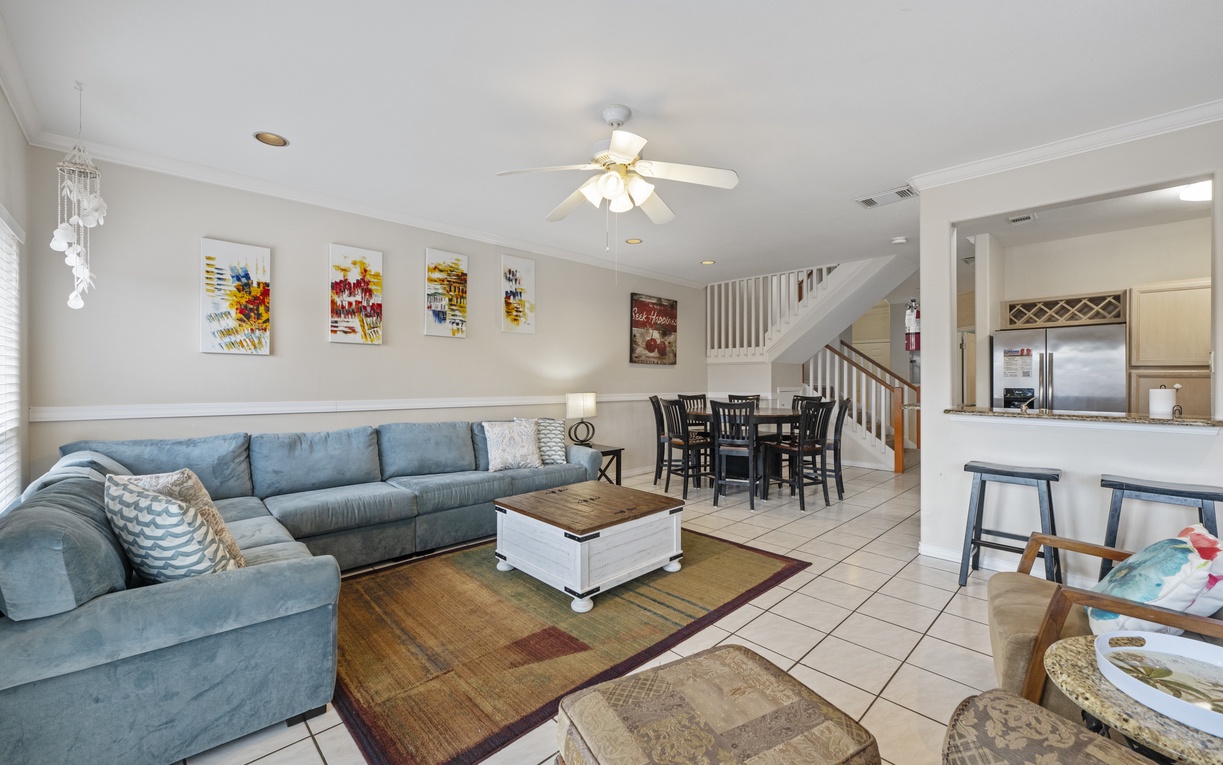 Relax in your spacious open-concept living area where comfort meets style, with cozy seating and modern amenities for your perfect getaway.