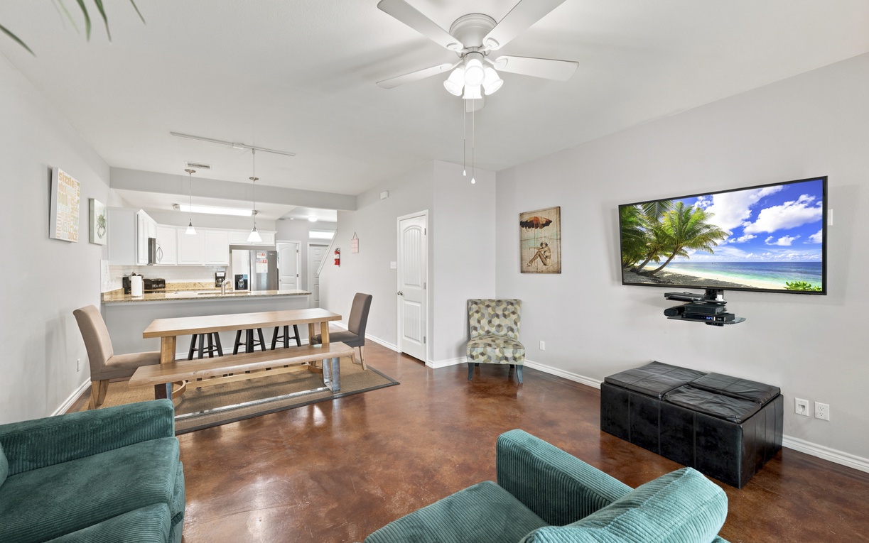 Settle into your bright living space with comfortable seating and open flow to the kitchen—perfect for gathering with your group.