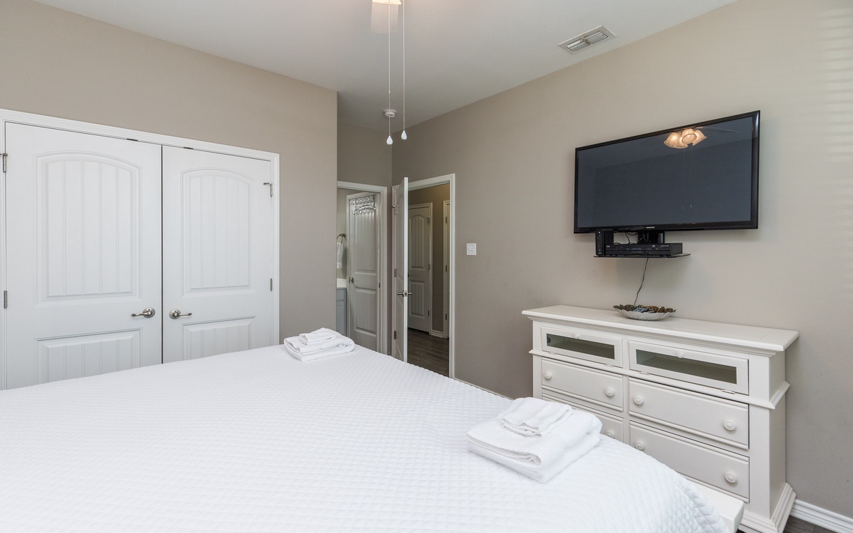 Unwind in your peaceful bedroom with premium linens, modern entertainment, and elegant furnishings for ultimate relaxation.