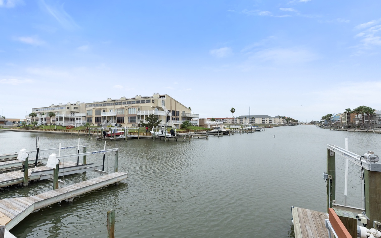 Waterfront community with private boat slip (no boat lift) and modern residences along peaceful canal waters.