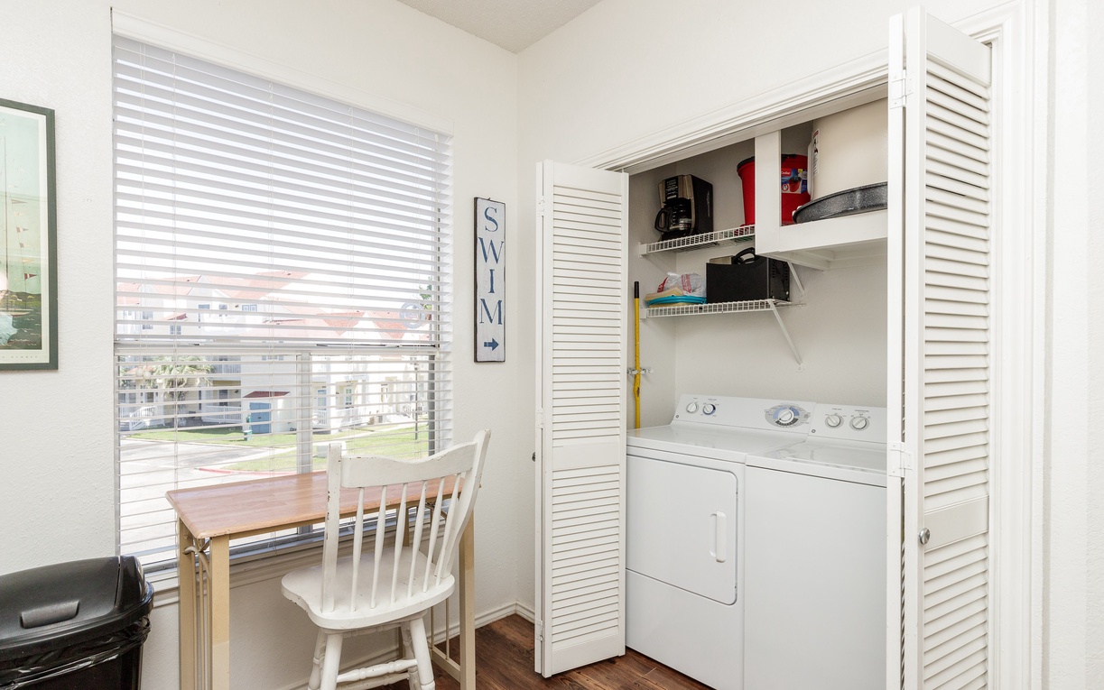 Your dedicated laundry space makes extended stays effortless, with a cozy dining nook for morning coffee overlooking the peaceful neighborhood.