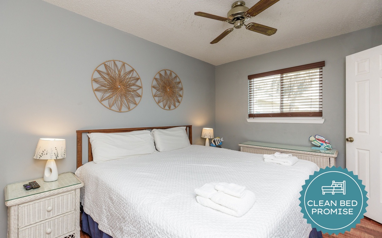 Drift into peaceful sleep in your comfortable bedroom, complete with crisp linens and gentle ceiling fan for perfect comfort.