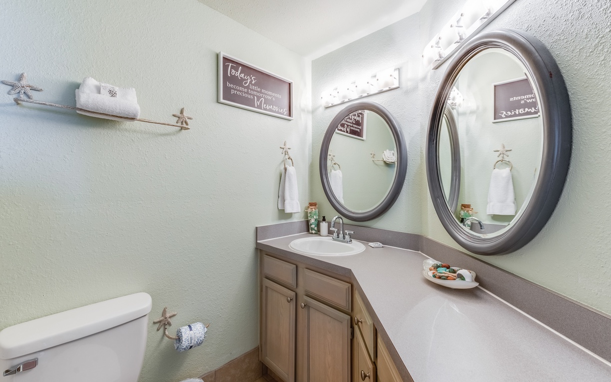 Your spacious bathroom features dual sinks and mirrors, perfect for sharing your morning routine with travel companions.