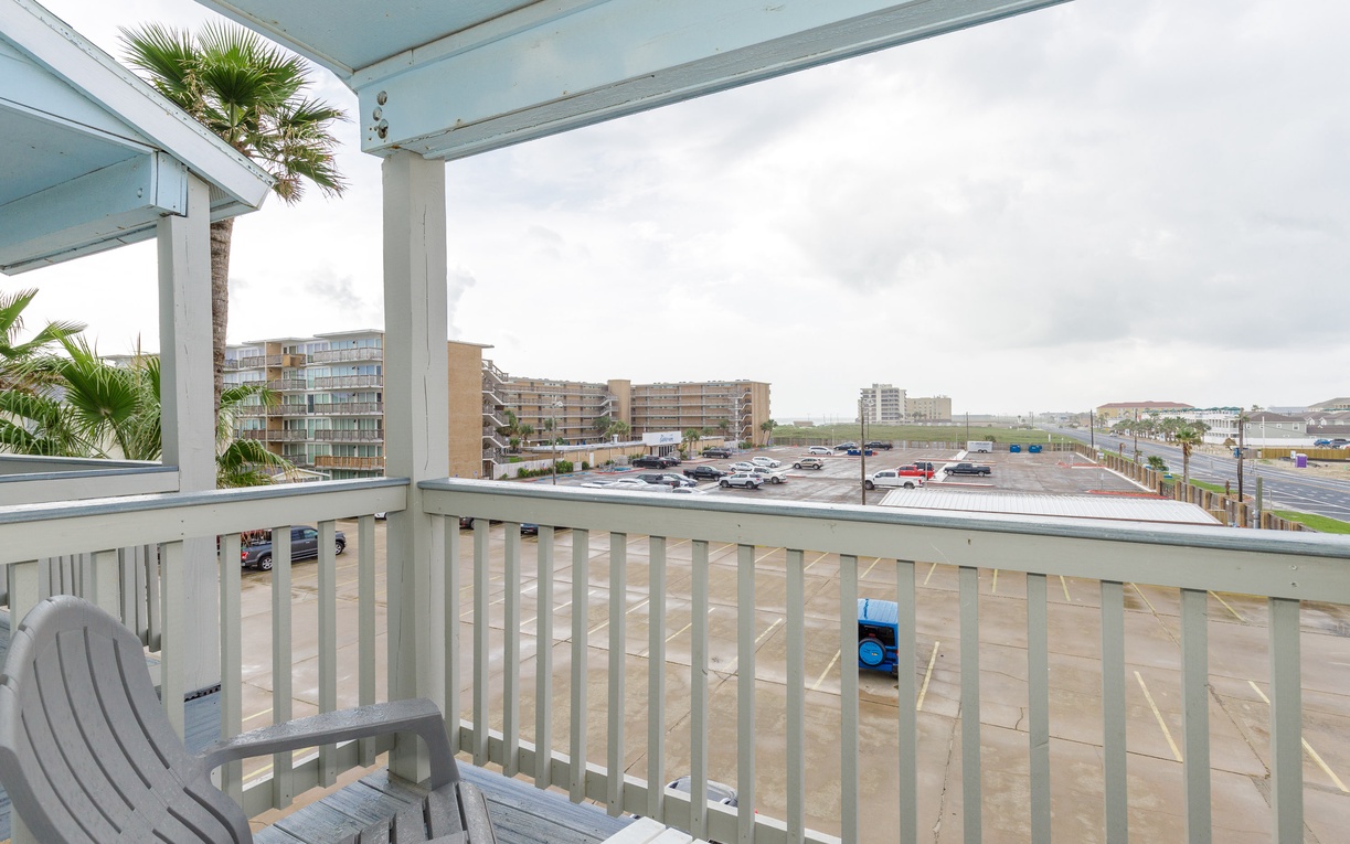 Your private balcony offers comfortable seating to enjoy views of the surrounding area and nearby buildings.