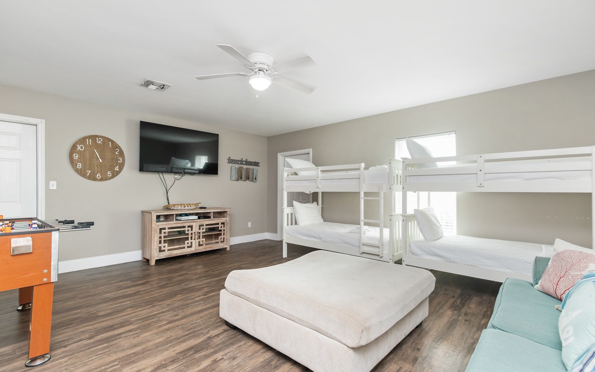 Your family room offers comfy bunk beds, cozy seating, and entertainment for memorable nights together.