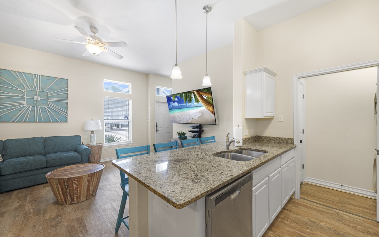 Your bright, open-concept space blends coastal style with modern comfort, featuring granite counters and ocean breezes on screen.