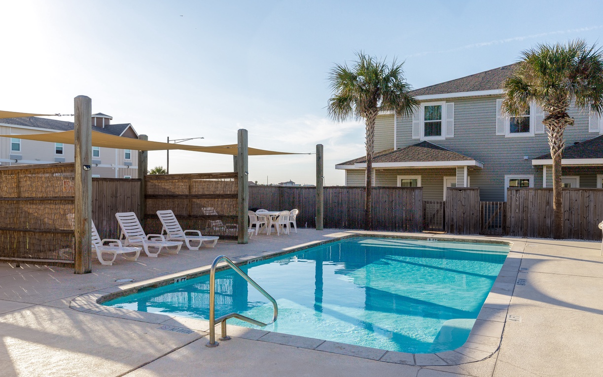 Dive into your private pool oasis, where sun loungers and shade sails create the perfect spot for lazy afternoons under swaying palms.
