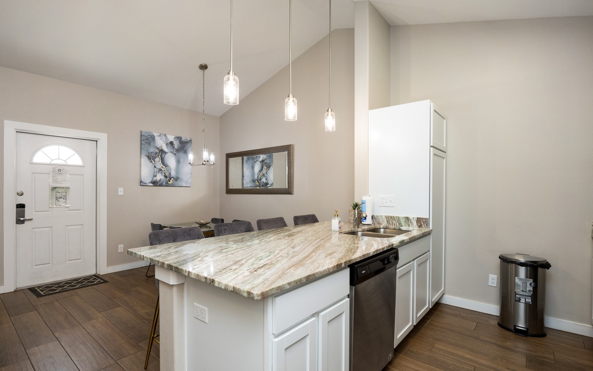 Your stylish kitchen island offers marble countertops and pendant lighting, perfect for preparing meals and gathering with loved ones.