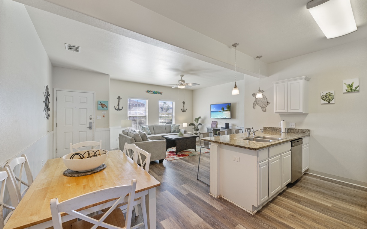 Step into your bright, coastal-themed retreat with open living spaces, modern kitchen, and charming nautical touches throughout.