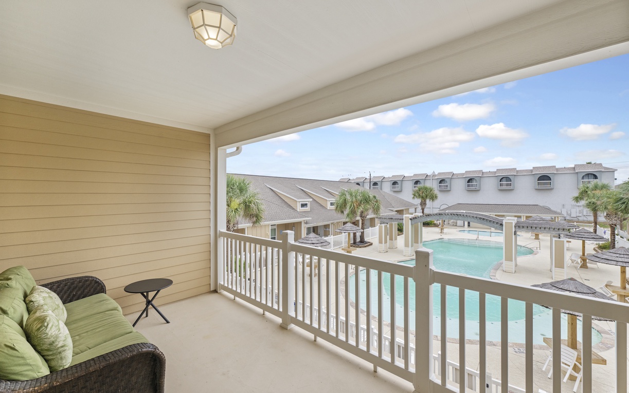 Your private balcony overlooking the sparkling pool creates the perfect spot to sip morning coffee or unwind with evening cocktails.