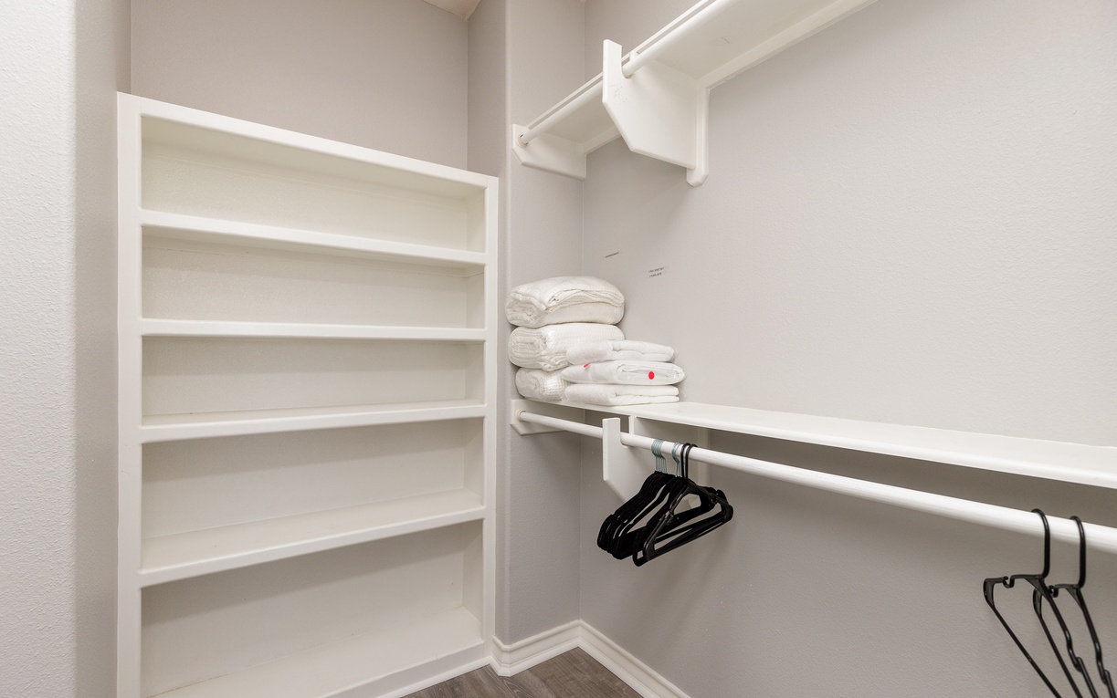 Your spacious walk-in closet features custom shelving and hanging space to keep your belongings perfectly organized during your stay.