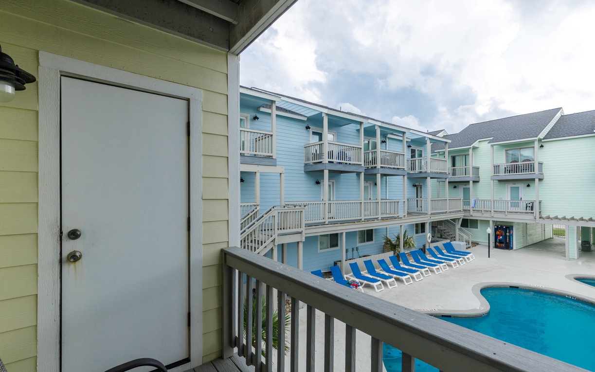 Pool view from your private living area balcony overlooking the vibrant courtyard.