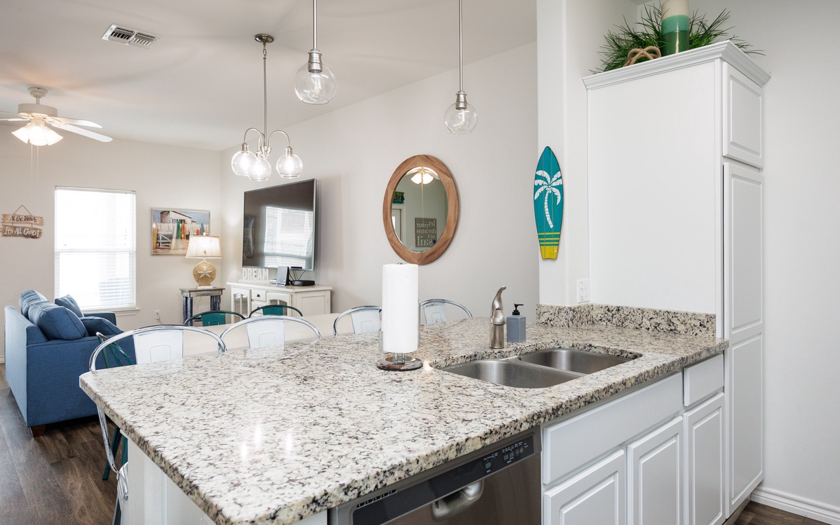 Your granite kitchen island opens to the living area, creating the perfect space for cooking and socializing.