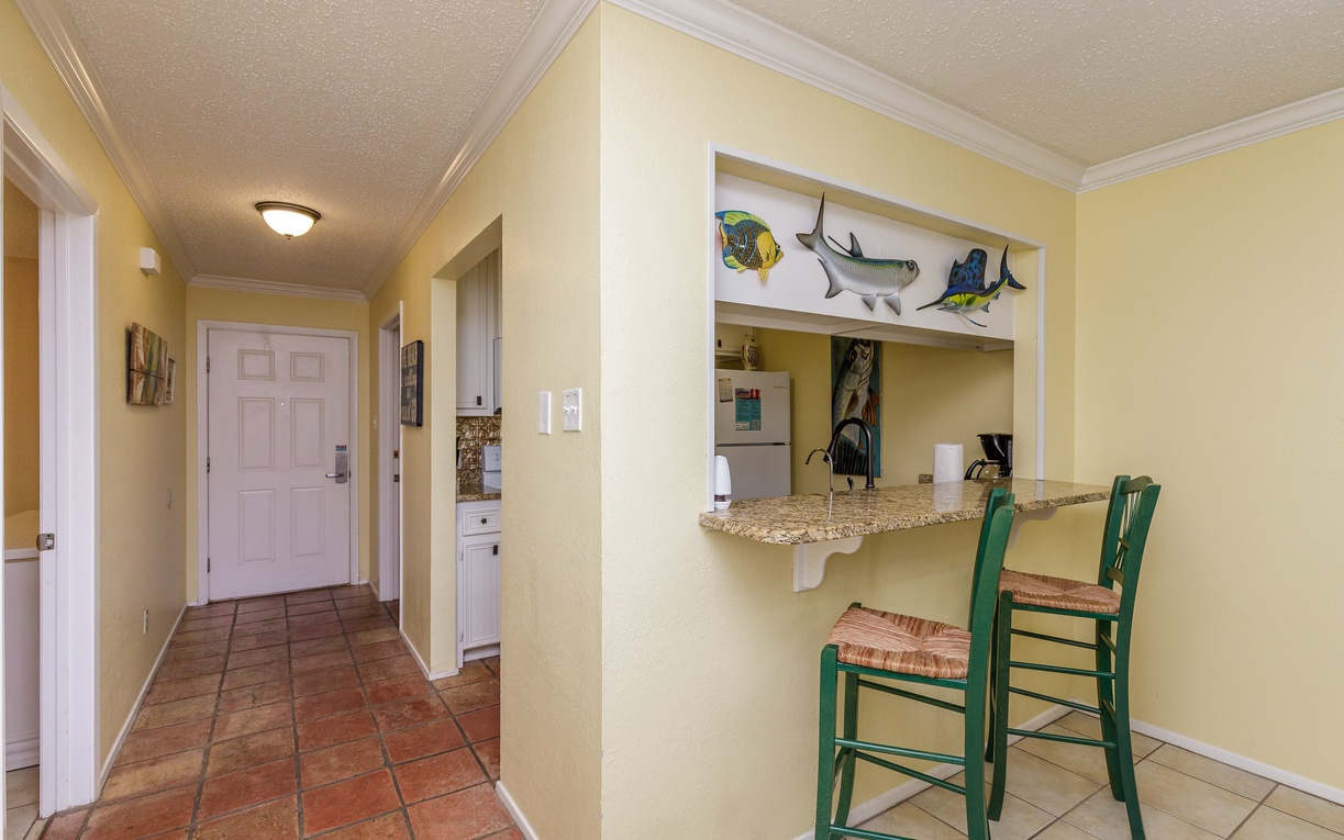 Enjoy coastal charm with your breakfast bar overlooking the kitchen, perfect for morning coffee or casual meals.