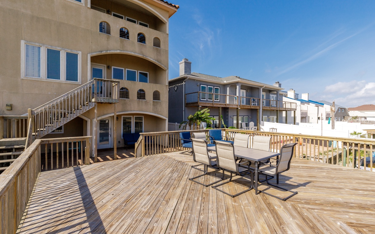 Your spacious beachside deck invites you to dine al fresco while soaking up endless ocean views and coastal charm.