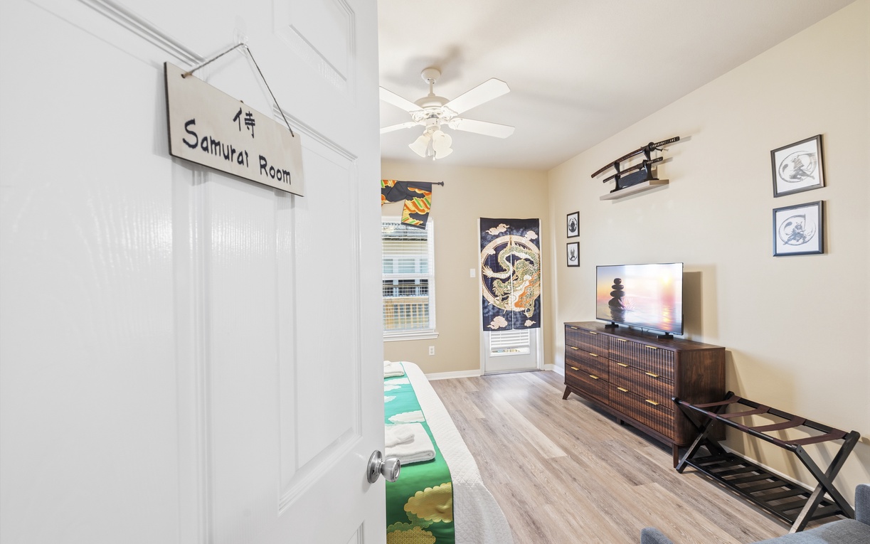 Step into your own Samurai Room, where Japanese-inspired decor meets modern comfort. Relax under the ceiling fan as you enjoy Asian art, a TV for your entertainment, and natural light streaming through the windows.