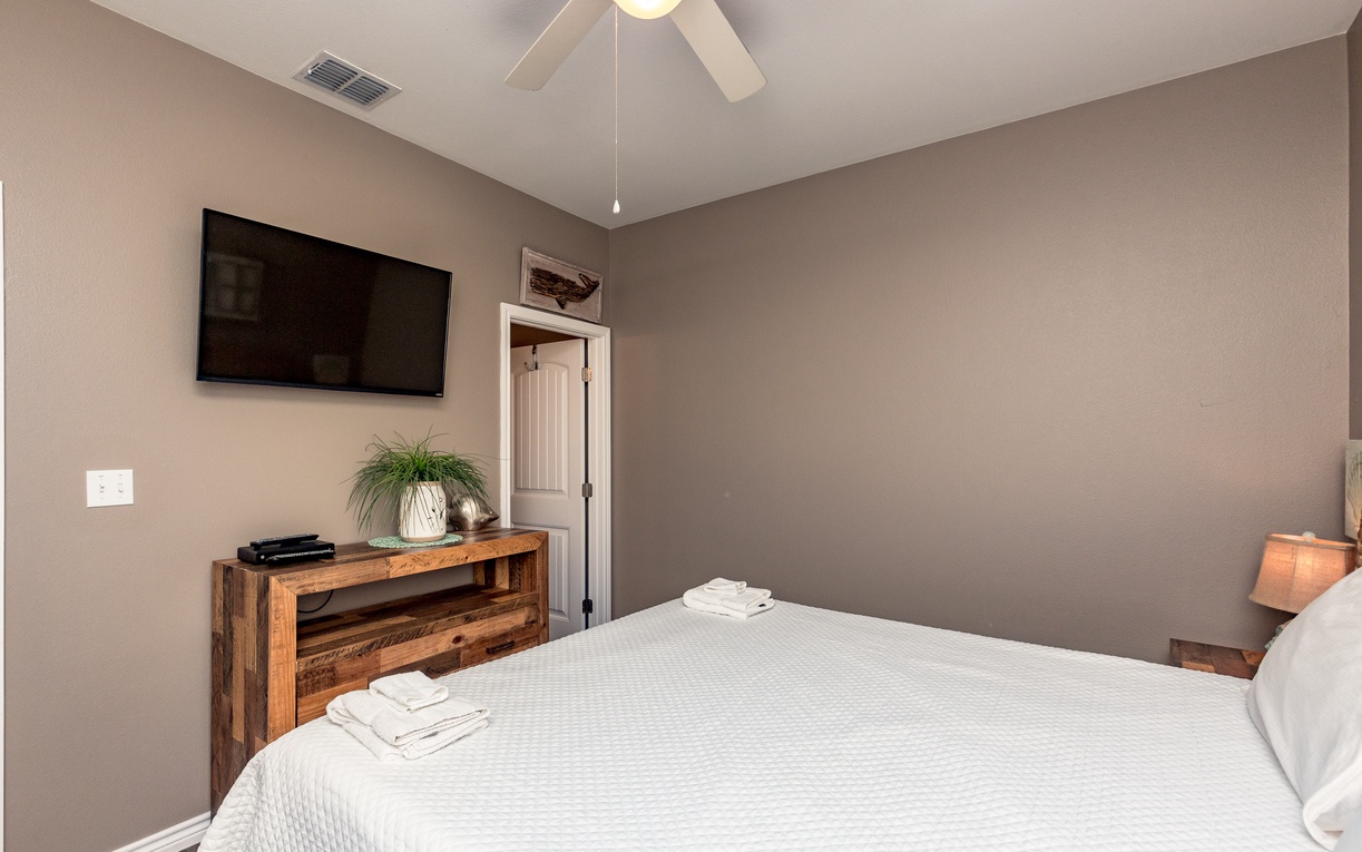 Slip into comfort in your peaceful bedroom, complete with crisp linens, entertainment, and thoughtful touches for a restful retreat.