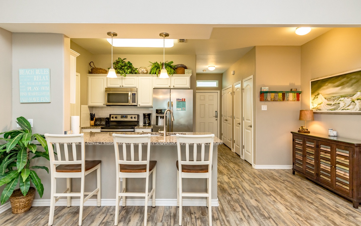 Your fully equipped kitchen invites you to create memorable meals with granite countertops, stainless appliances, and a breakfast bar for casual dining.