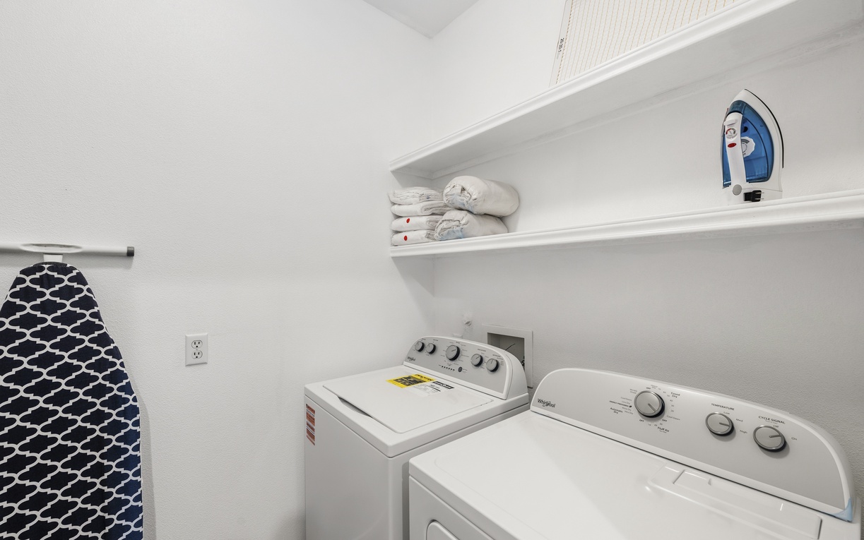 Your own in-unit washer and dryer mean you can pack light and keep your clothes fresh throughout your stay. Shelves provide handy storage for detergent and supplies.