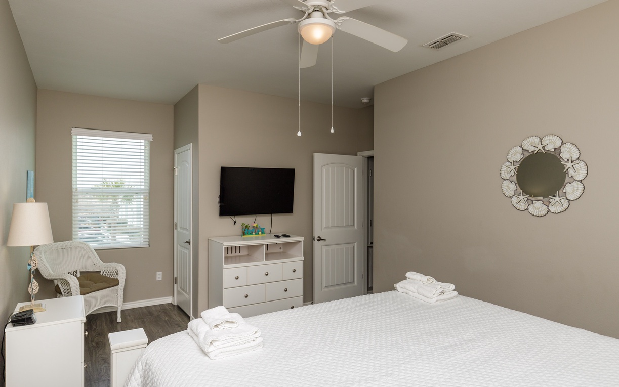 Unwind in your serene bedroom featuring crisp linens, gentle ceiling fan, and thoughtful touches that make you feel right at home.