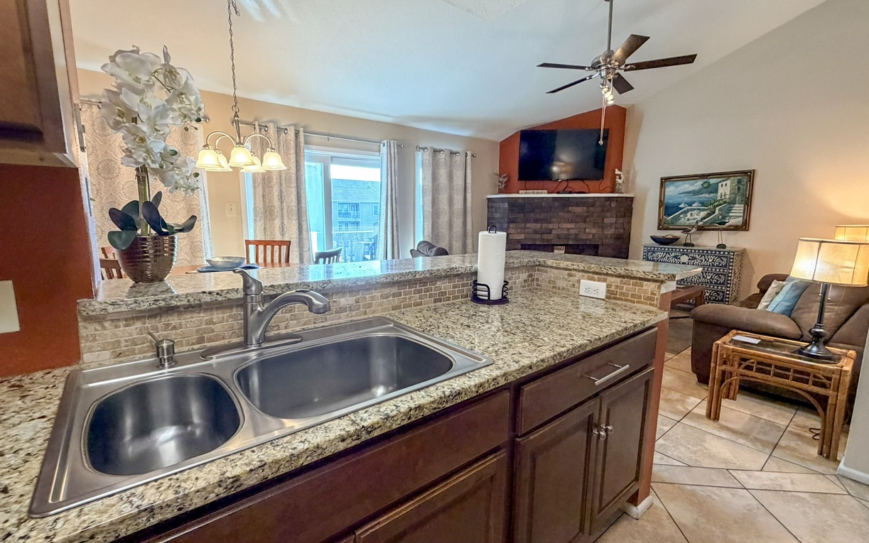 Open kitchen flows seamlessly into your cozy living space, perfect for preparing meals while staying connected with family and friends.