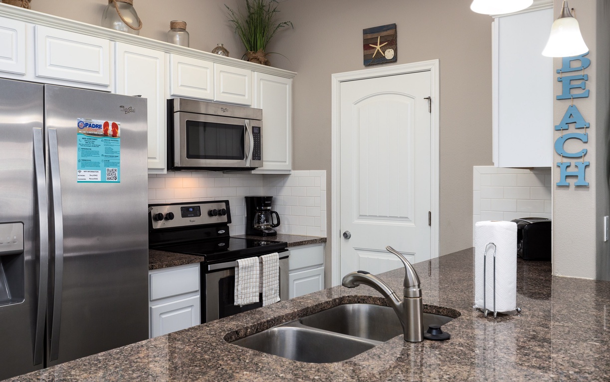 Your fully equipped kitchen features granite counters, stainless appliances, and everything you need to prepare meals during your stay.