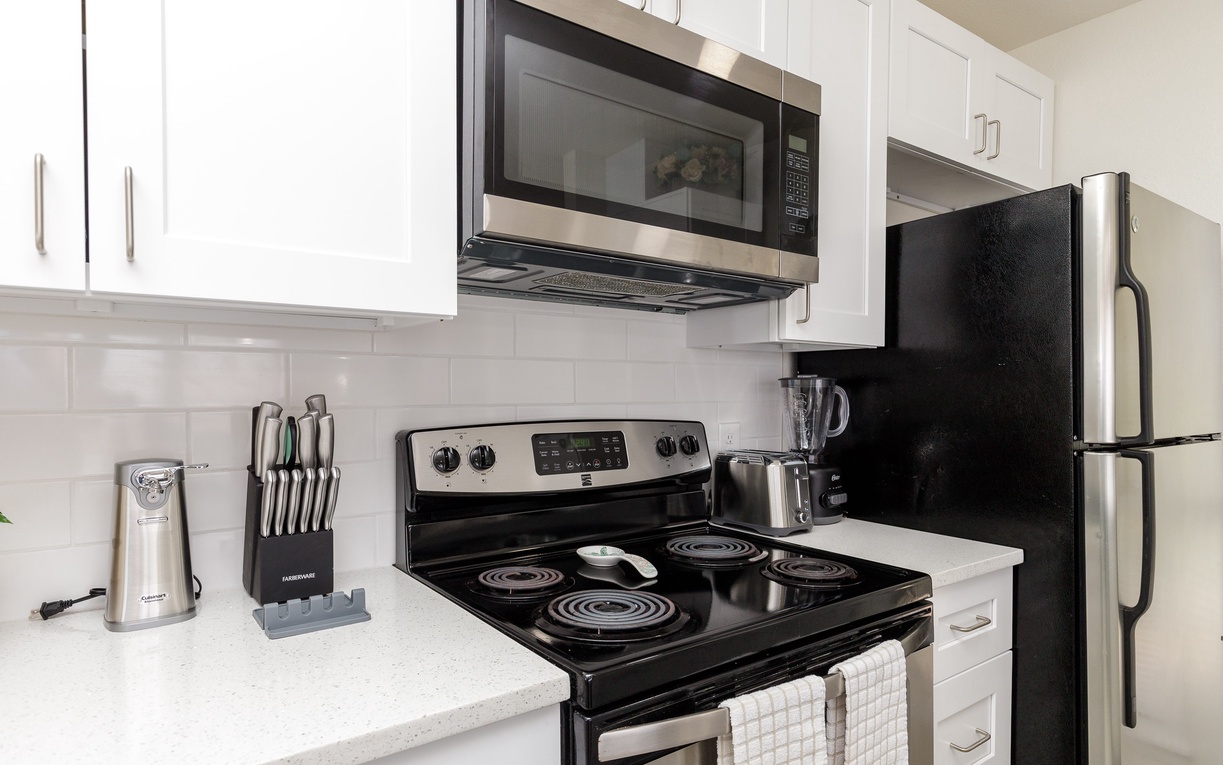 Prepare your favorite meals in this fully-equipped kitchen featuring modern appliances and ample counter space for all your culinary adventures.