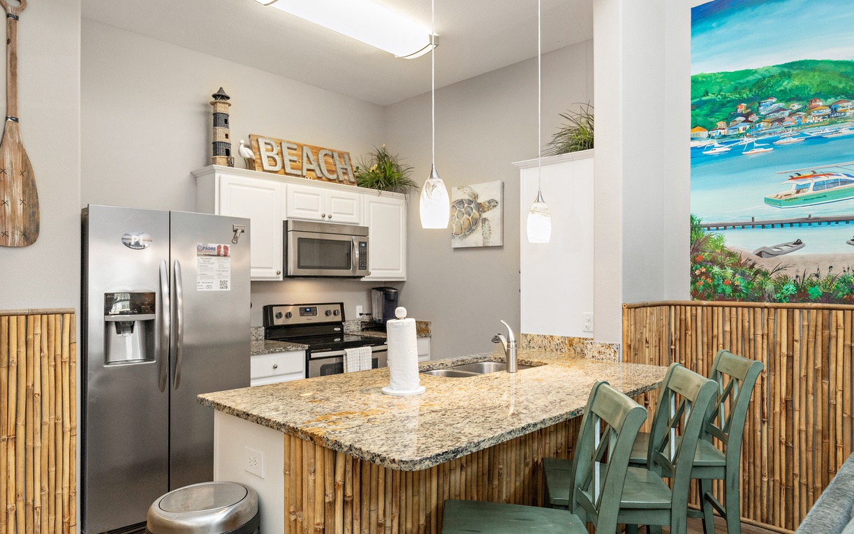 Your beach-themed kitchen invites coastal living with bamboo accents, granite counters, and tropical artwork creating your perfect island getaway.