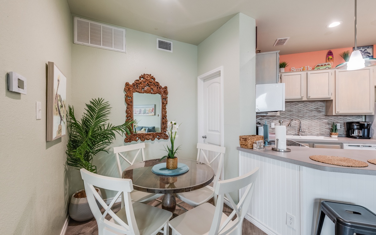 Gather around your stylish dining nook with cozy seating for four, perfectly positioned next to your fully-equipped kitchen for effortless meal prep.