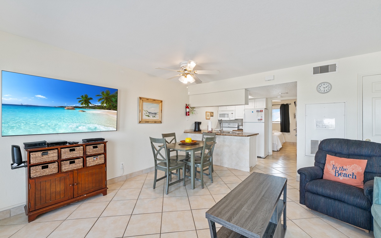 Relax in your bright, open-concept space with tropical vibes, complete kitchen, and beach-themed touches that invite you to unwind.