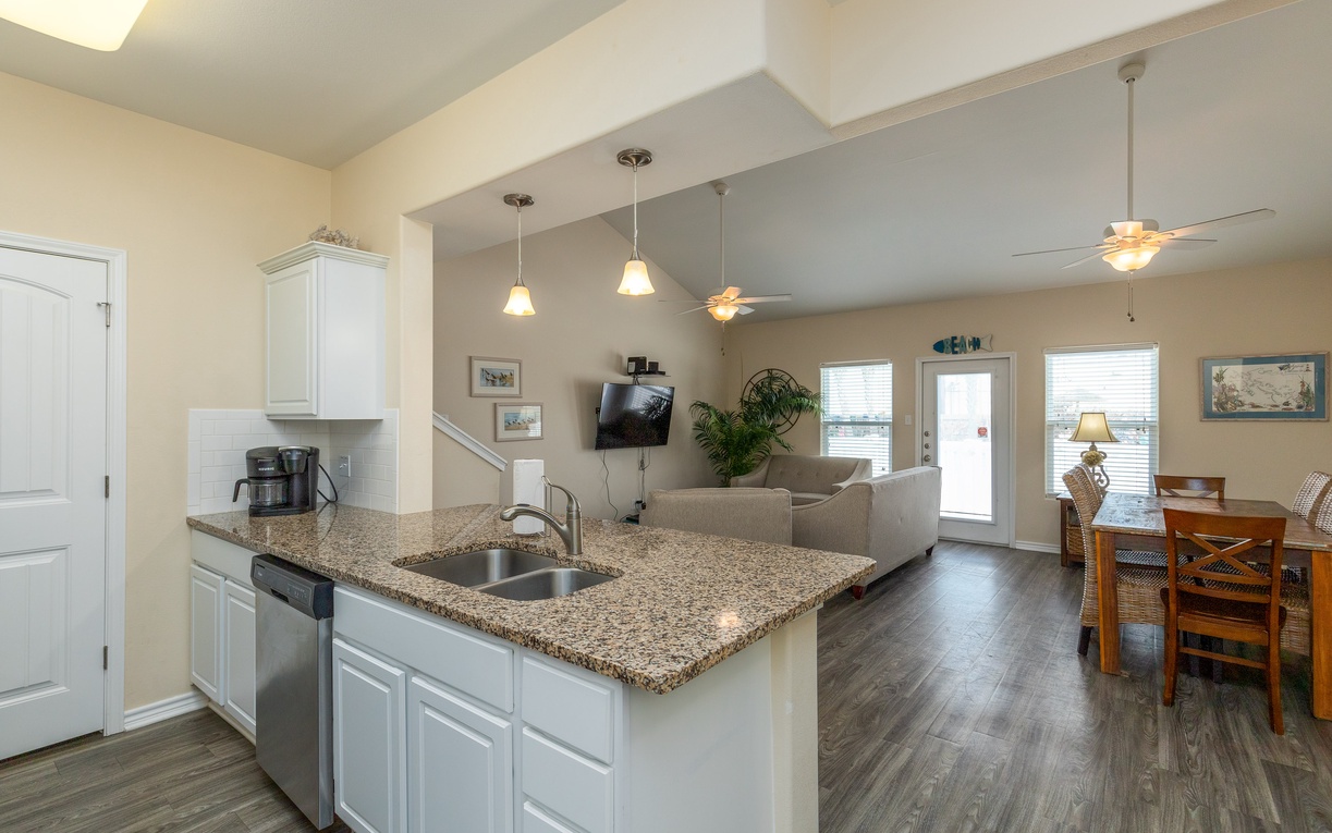Your open-concept kitchen flows seamlessly into the living area, perfect for preparing meals while staying connected with everyone.