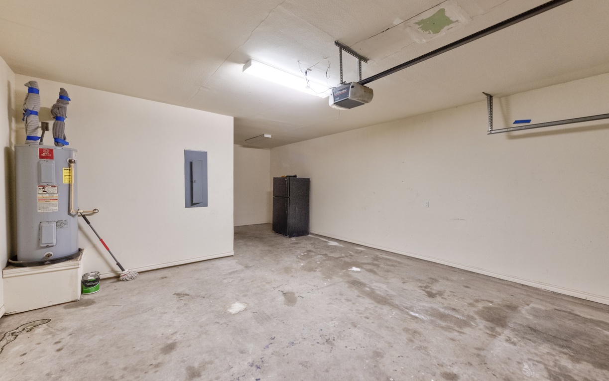 Spacious garage with ample storage room for your gear and vehicle, plus convenient utility access.