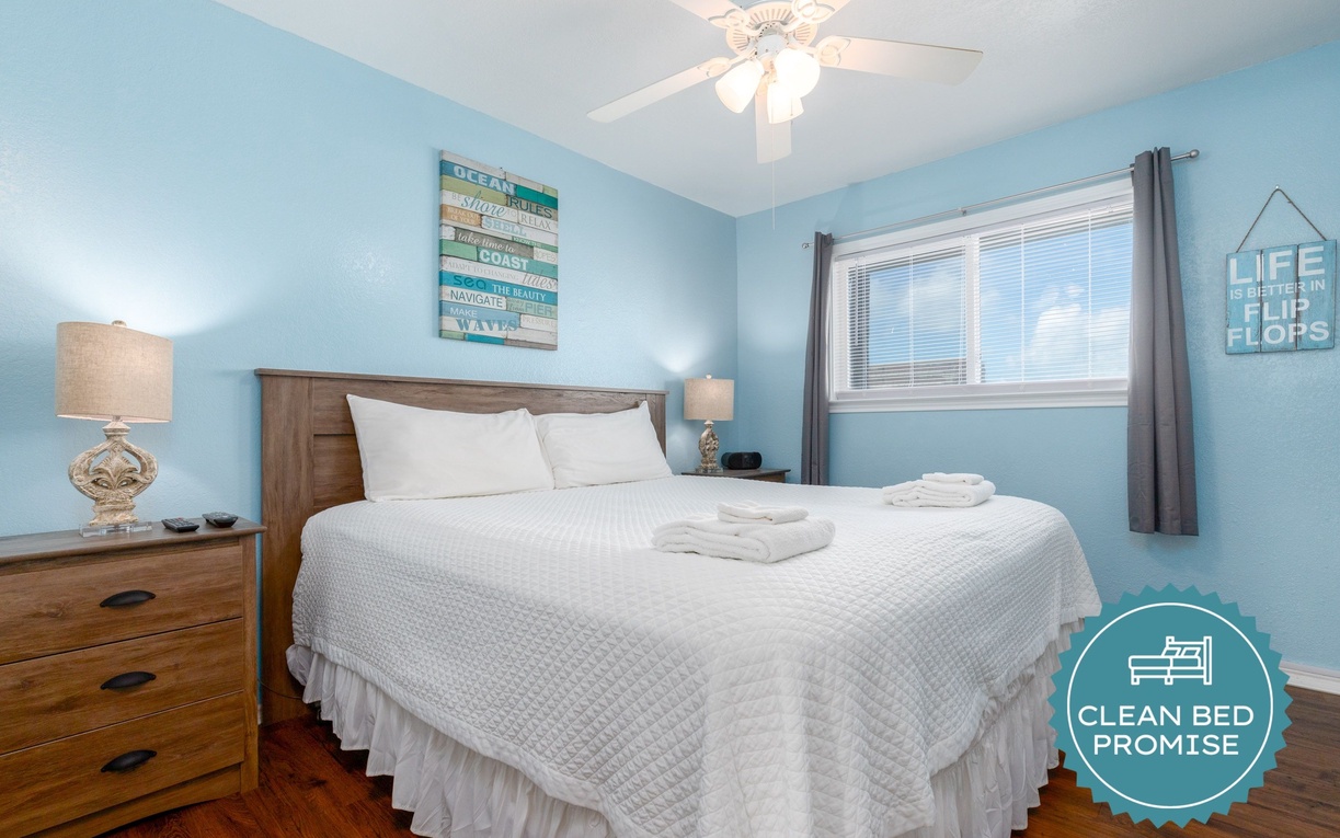 Drift off to sleep in your coastal-themed bedroom, where soothing blue walls and beach decor create the perfect seaside retreat.
