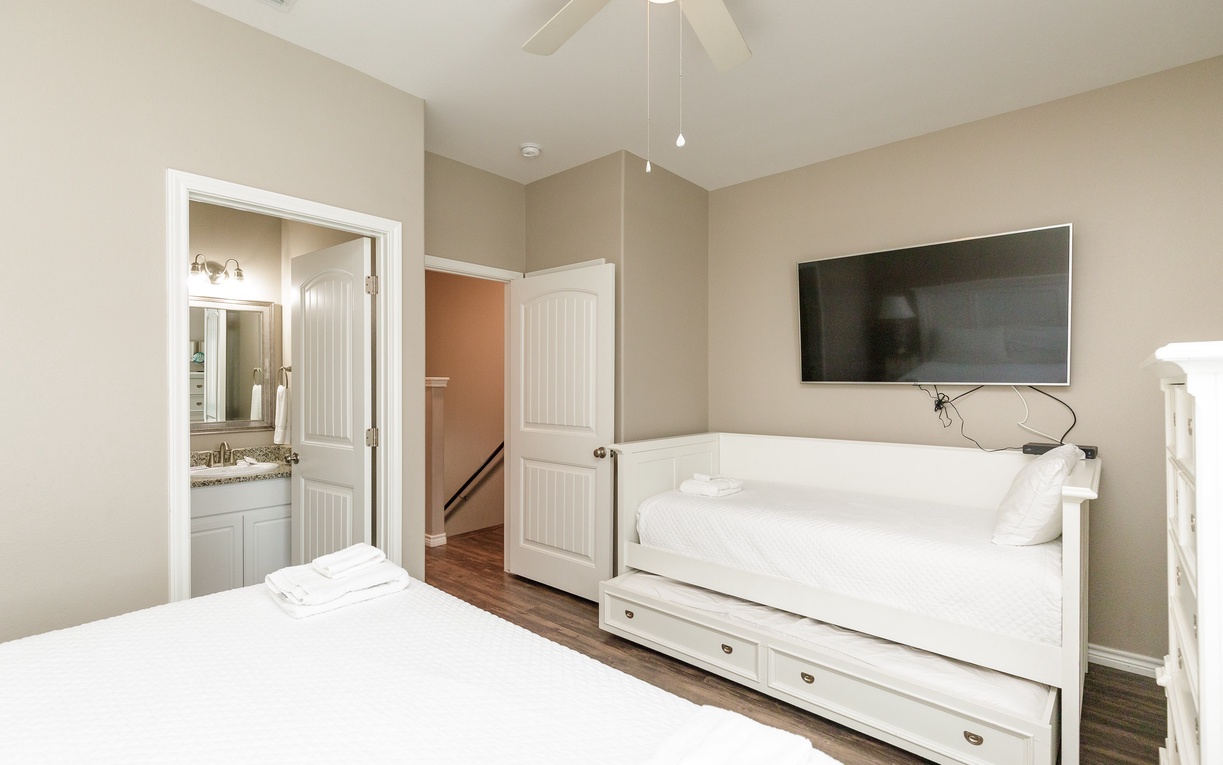 Relax in your primary bedroom with a private bathroom and private balcony.