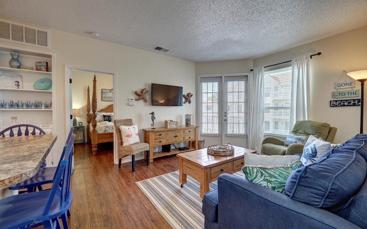 Unwind in this cozy coastal living room where nautical touches and plush seating create your perfect beach getaway retreat.