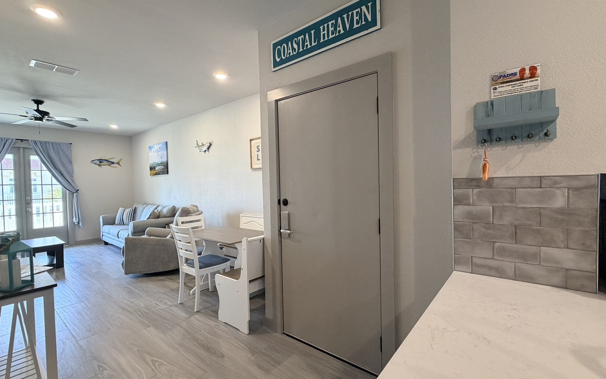 Your coastal-themed retreat awaits with an open layout connecting kitchen, dining, and living spaces for effortless entertaining.