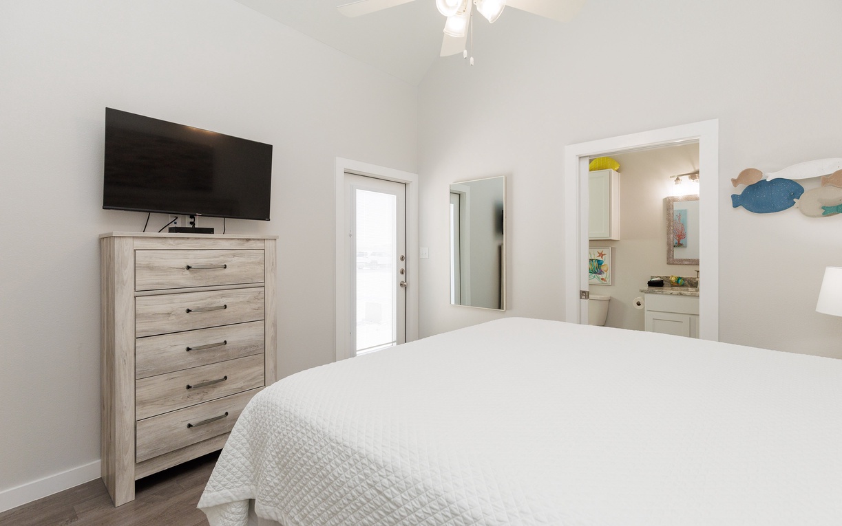 Unwind in your serene bedroom with cozy linens, smart TV entertainment, and an ensuite bathroom for complete comfort.