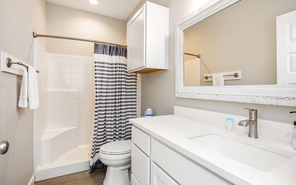 Your private bathroom features a relaxing tub-shower combo and modern vanity for your comfort.