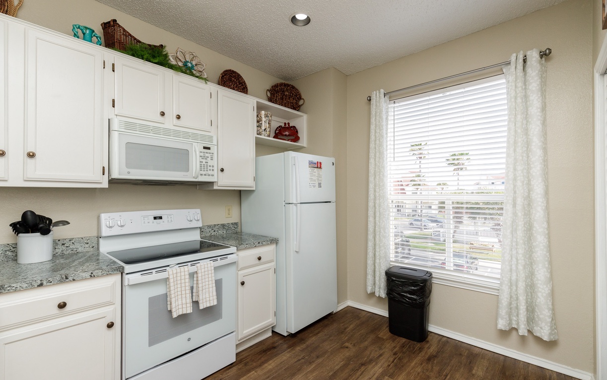 Step into your fully equipped kitchen with modern appliances and plenty of storage—perfect for cooking meals and staying comfortable during your stay.