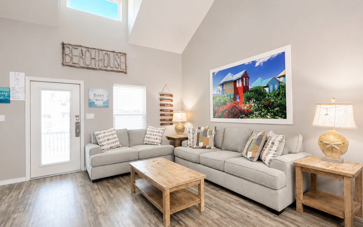 Sink into your stylish sanctuary with vaulted ceilings and skylights bathing the space in natural warmth, creating the perfect retreat after beach adventures.
