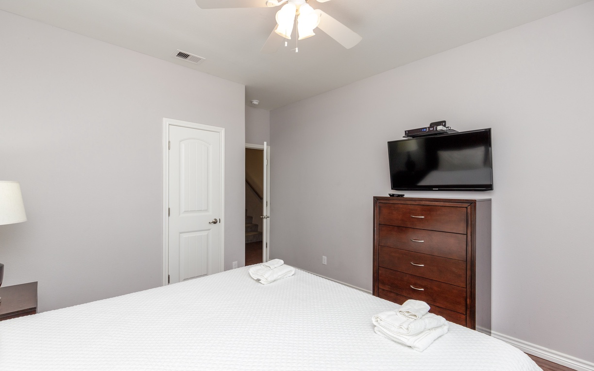 Unwind in your serene bedroom with plush linens, entertainment, and thoughtful touches for ultimate comfort.