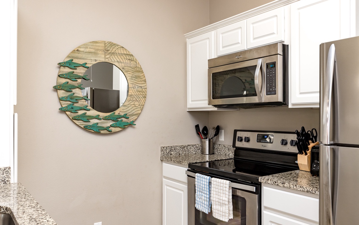 Your fully equipped kitchen features stainless steel appliances and granite countertops, perfect for preparing meals during your stay.