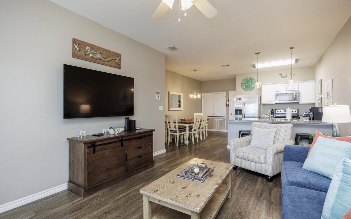 Your spacious open-plan retreat combines comfort and style, where you can unwind on plush seating while enjoying modern entertainment and home-cooked meals.