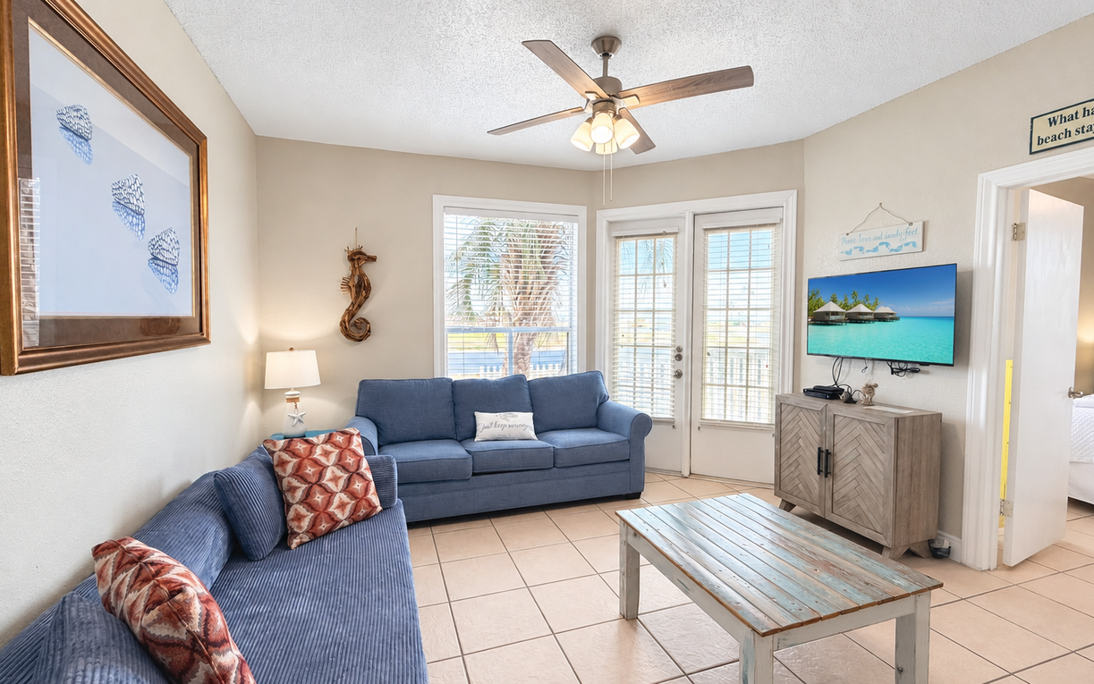 Your bright coastal escape awaits with cozy seating, beach-themed touches, and easy access to the outdoors—perfect for unwinding after a day of sun and sand.