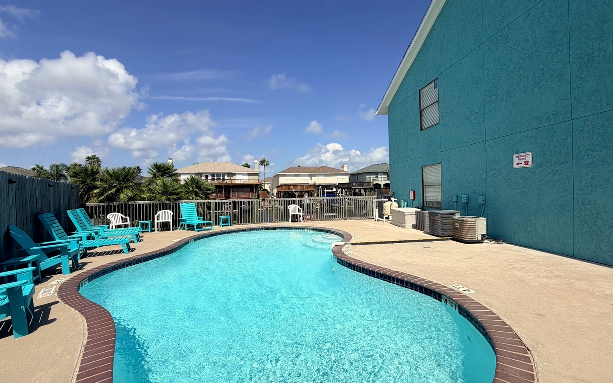 Dive into your private oasis! This sparkling pool awaits your morning laps and afternoon relaxation under endless blue skies.
