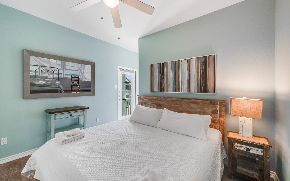 Drift off to sleep surrounded by soothing coastal colors and rustic wooden touches in your peaceful bedroom retreat.