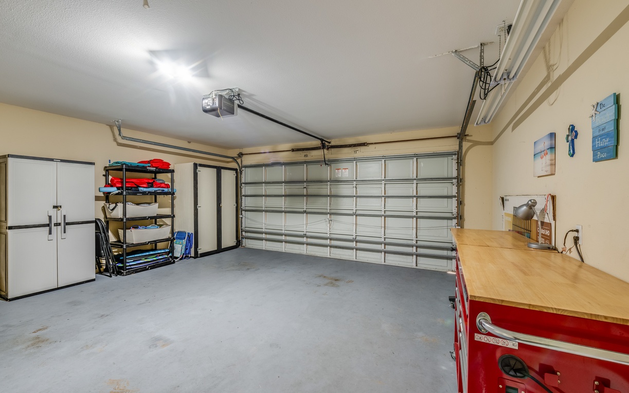 Spacious garage with organized storage and workspace keeps your gear secure and adventure-ready.