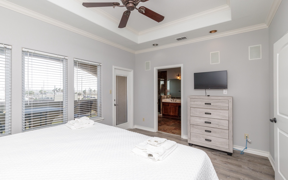 Relax in your serene bedroom with crisp linens, elegant furnishings, and a private en-suite bathroom just steps away.