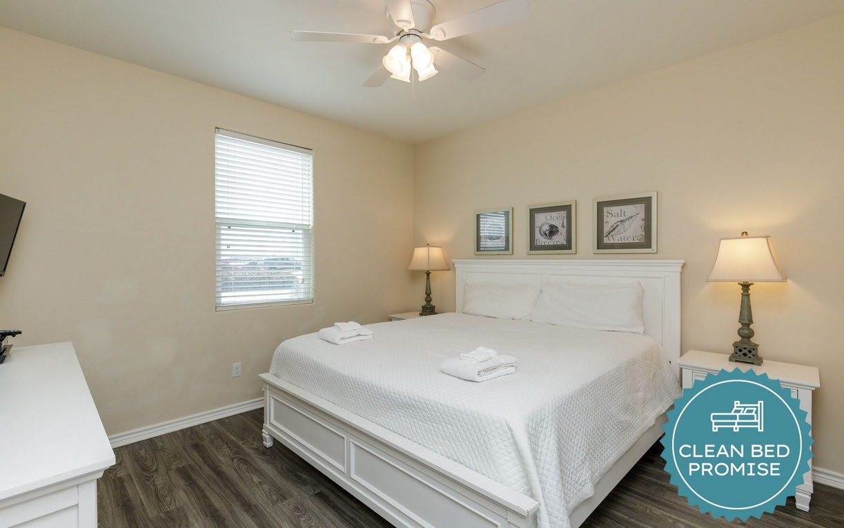 Sink into crisp white linens and enjoy peaceful mornings in this serene bedroom with soft natural light and thoughtful coastal touches.